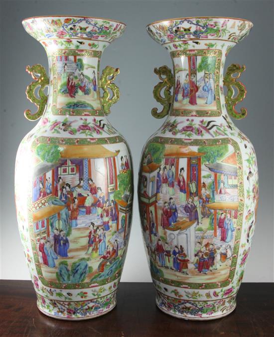 A pair of large Chinese Canton-decorated twin handled vases, Daoguang Period (1821-50), 64cm, slight faults to handles